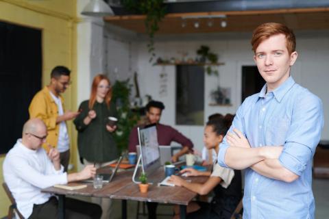 Young professionals looking at a laptop
