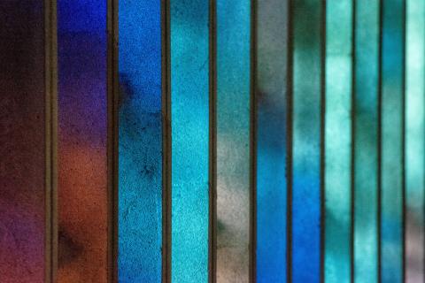 Stained glass varying in shades of blue and green