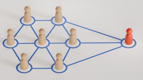 A group of figures all connected to one figure