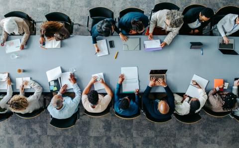 Top view of diverse business group in office meeting
